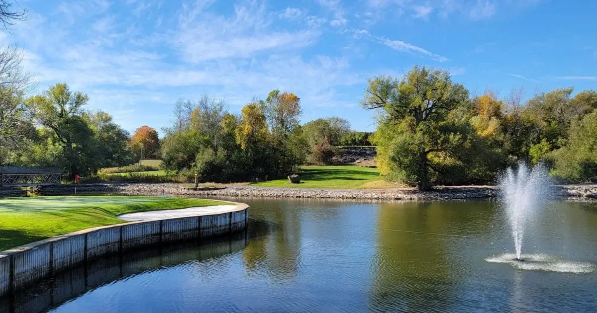 Scenic lakeside golf course with fountain view
